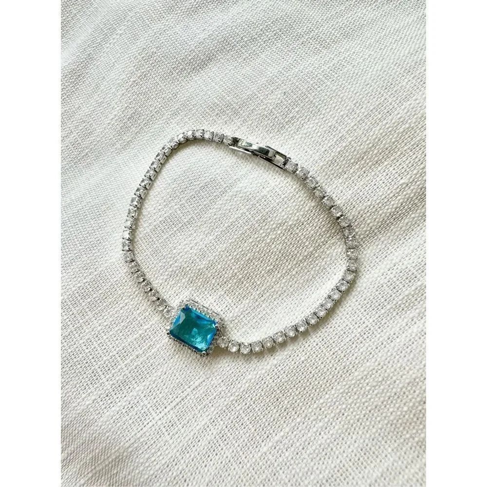 Light blue elongated radiant cut tennis bracelet - 7 3/4 inches long